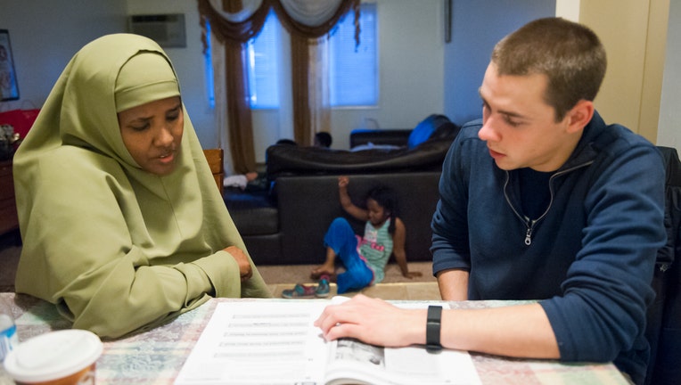 Somali immigrant Ayan Abdi works on an English language lesson in North Dakota.