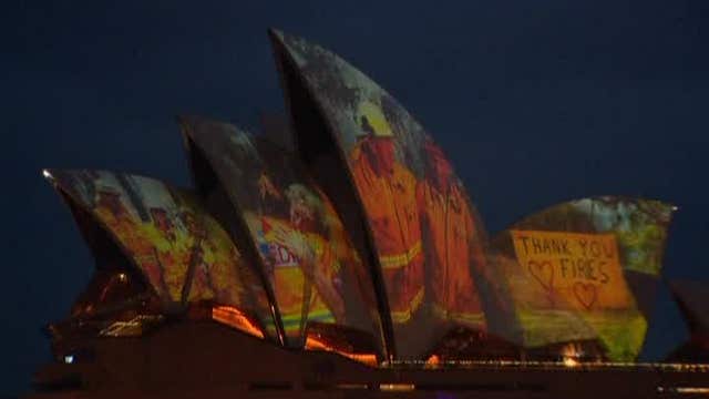 Sydney Opera House illuminates with faces of fire fighters battling wildfires