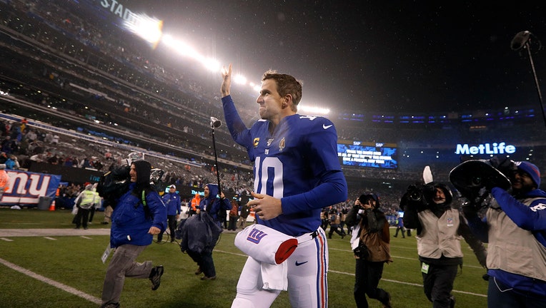 Eli Manning of the New York Giants runs off the field after a game against the Philadelphia Eagles at MetLife Stadium in East Rutherford, New Jersey, Dec 29, 2019.