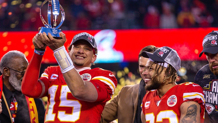 Kansas City Chiefs quarterback Patrick Mahomes (15) lifts the championship trophy after winning against the Tennessee Titans at Arrowhead Stadium in Kansas City, Missouri. (Photo by William Purnell/Icon Sportswire via Getty Images)