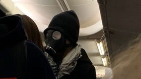 Man wearing gas mask on plane starts panic, has to be escorted off flight