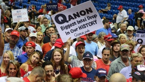 QAnon supporters sharing 'deep state' satanic sex trafficking ring/cannibalism theories at Trump rallies