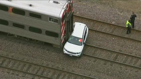 2 taken to hospital after Metra UP-NW train hits vehicle in Arlington Heights