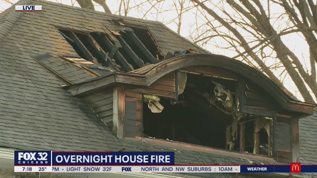 Man rescued from roof of burning home in Austin