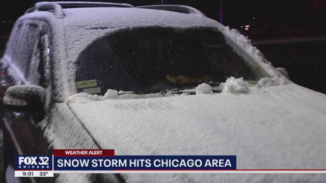 Snow falls across Chicago area as wind creates visibility problems for drivers
