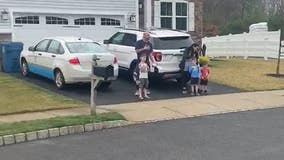 Elementary students recite Pledge of Allegiance on driveways amid coronavirus pandemic