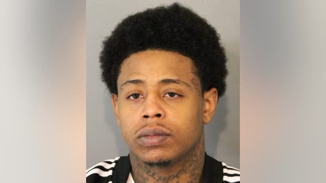 Man charged after loaded guns seized from gathering at Gold Coast hotel