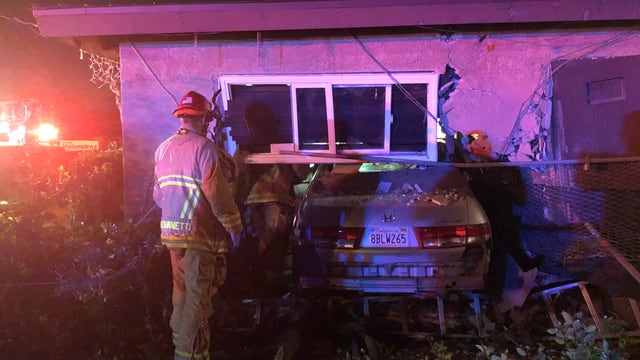 Car crashes into bedroom, pins sleeping man against wall (and he survives)