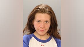 Police: Woman charged after spitting on 2 people in separate incidents