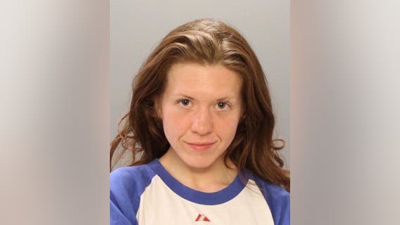 Police: Woman charged after spitting on 2 people in separate incidents