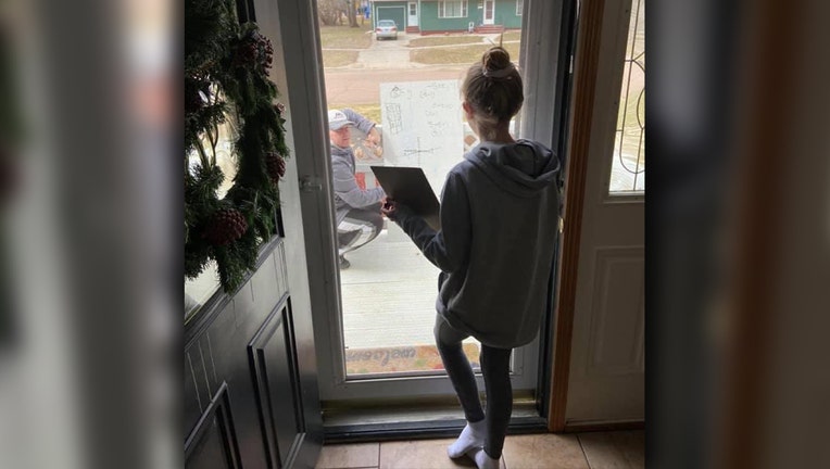 Math teacher brings over whiteboard to help student ...