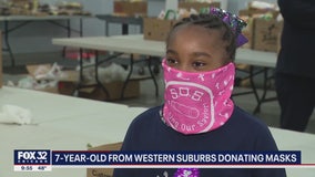 7-year-old suburban girl donating masks to anyone she can