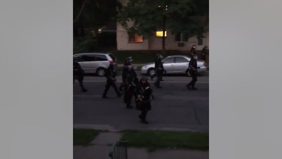 Video: Law enforcement fires paint projectile at residents on porch during curfew in Minneapolis