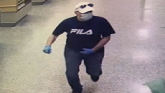 Surveillance video released of man pulling out gun inside Publix, threatening customer