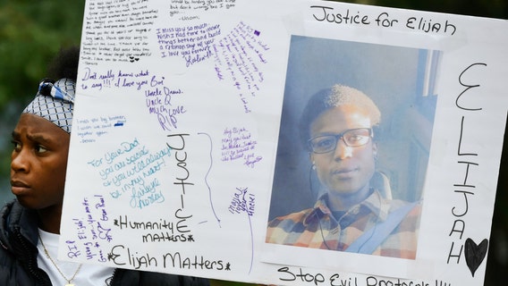 Thousands gather to demand justice for Elijah McClain, a 23-year-old who died after police chokehold