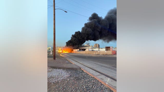Firefighters battle train fire in Central Phoenix