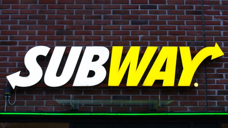 Subway employee making sandwich