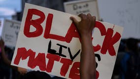 Black Lives Matter billboard placed next to Confederate flag in small town outside Raleigh