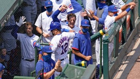 Without fans making noise, Cubs and Brewers shout at each other without leaving dugouts