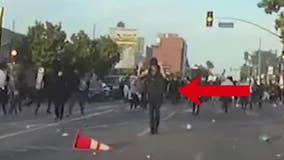 LAPD video shows protester with hands up being shot with less-than-lethal round