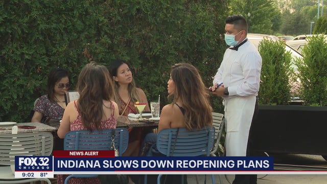 Indiana delays lifting capacity limits on restaurants, bars