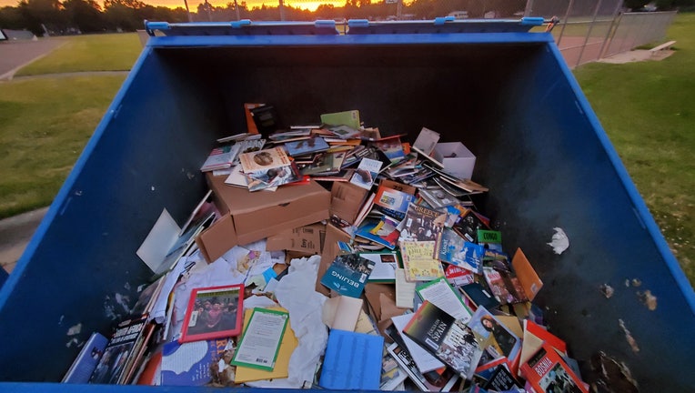 books in dumpster 3