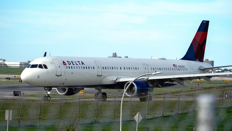 Delta Airlines aircraft taxiing at La Guardia Airport.