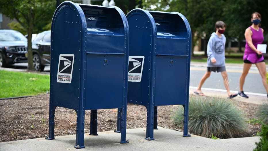 FILE - Mailboxes sit outside of a Morris Plains, NJ post office on August 17, 2020 in Morris Plains, New Jersey. 