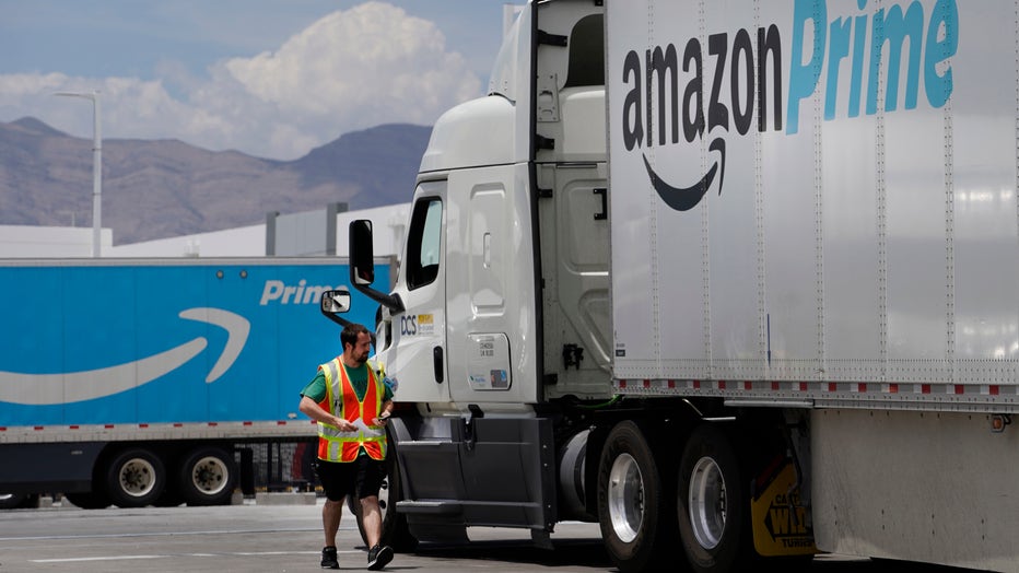 A security guard check in an Amazon truck at the Amazon regional distribution center on June 6, 2019 in Las Vegas, Nevada.