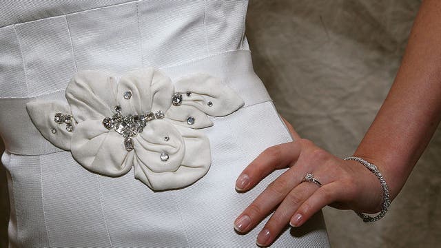 Bride-to-be claims future mother-in-law, sister-in-law ruined wedding dress after taking turns trying it on