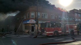 100 firefighters battle large South Side blaze