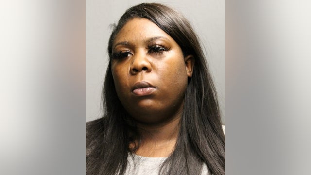 Woman charged with looting downtown store