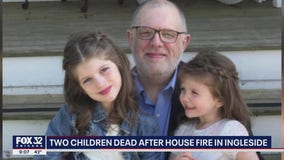 Two young girls killed in suburban house fire, four adults injured