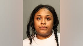 Woman charged with looting downtown shop in August