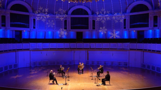 Musicians from the Chicago Symphony Orchestra perform festive music for the holidays