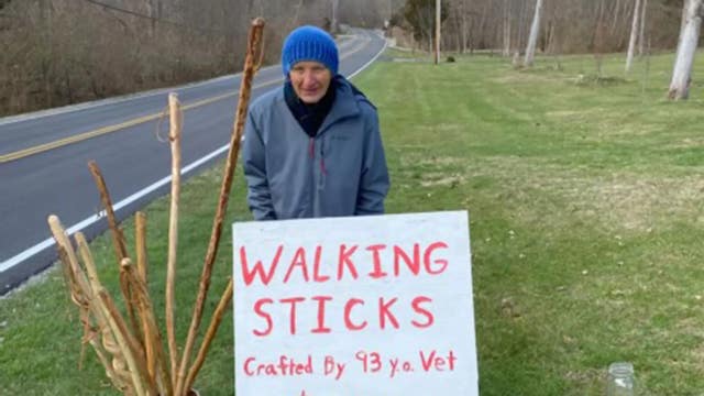 Retired Air Force colonel, 93, whittles walking sticks to raise money for food bank