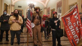 Marketing firm fires worker after he was photographed wearing company badge at pro-Trump US Capitol riot