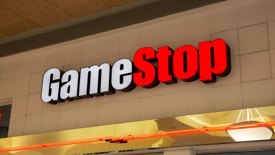 FILE - The GameStop sign seen inside the Susquehanna Valley Mall. An online group sent share prices of GameStop (GME) and AMC Entertainment Holdings Inc.