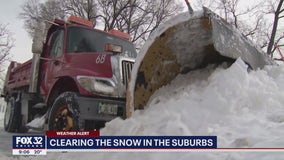 Some suburbs see over a foot of snow, crews continue to clear streets