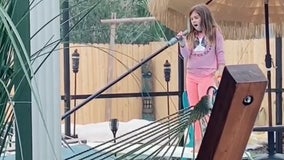 Florida girl caught singing 'Girl on Fire' while cleaning pool goes viral