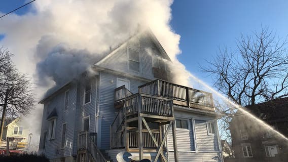 Fire tears through vacant Aurora home, sending crews retreating for cover