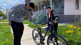 Student athletes give new bicycles to two military kids in Chicago