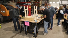 Suburban volunteers build desks for students learning remotely