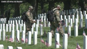 U.S. soldiers place flags at Arlington Cemetery ahead of Memorial Day weekend