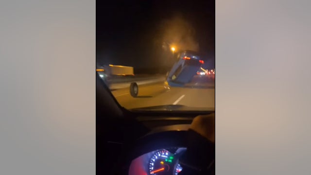 Driver goes airborne after hitting wheel rolling down highway, video shows