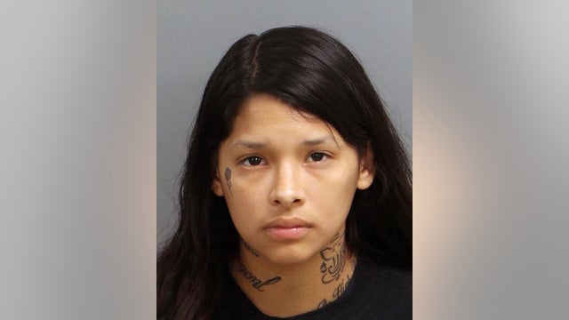 Woman, 18, charged with murder in cemetery death