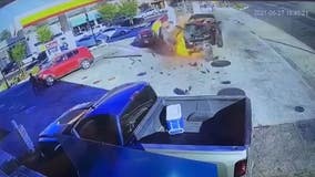 Video: Car crashes into gas pump at busy station, causing fire