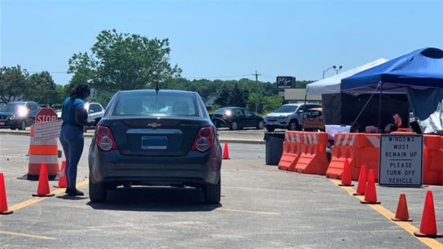 Aurora opens first state-run drive-thru COVID-19 vaccination site