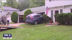 Evanston couple avoids tragedy after vehicle slams into their home