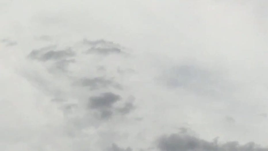 storyful face in clouds